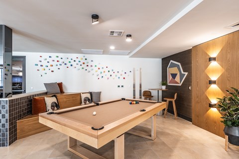 a games room with a pool table and a ping pong table