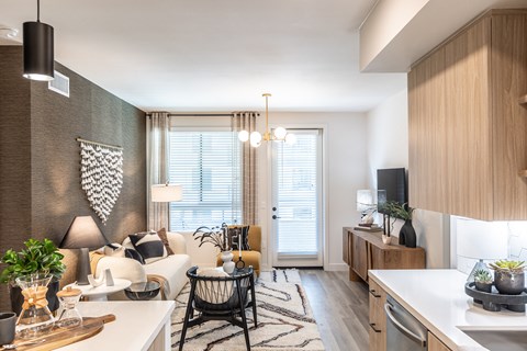 a living room and kitchen in a two bedroom apartment