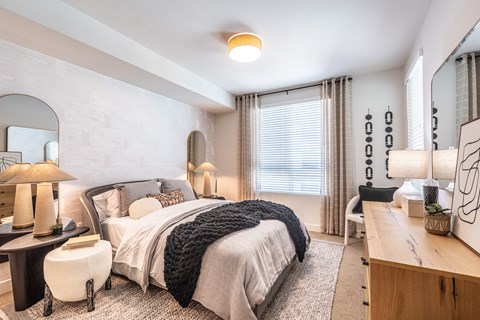 a bedroom with a bed and a desk