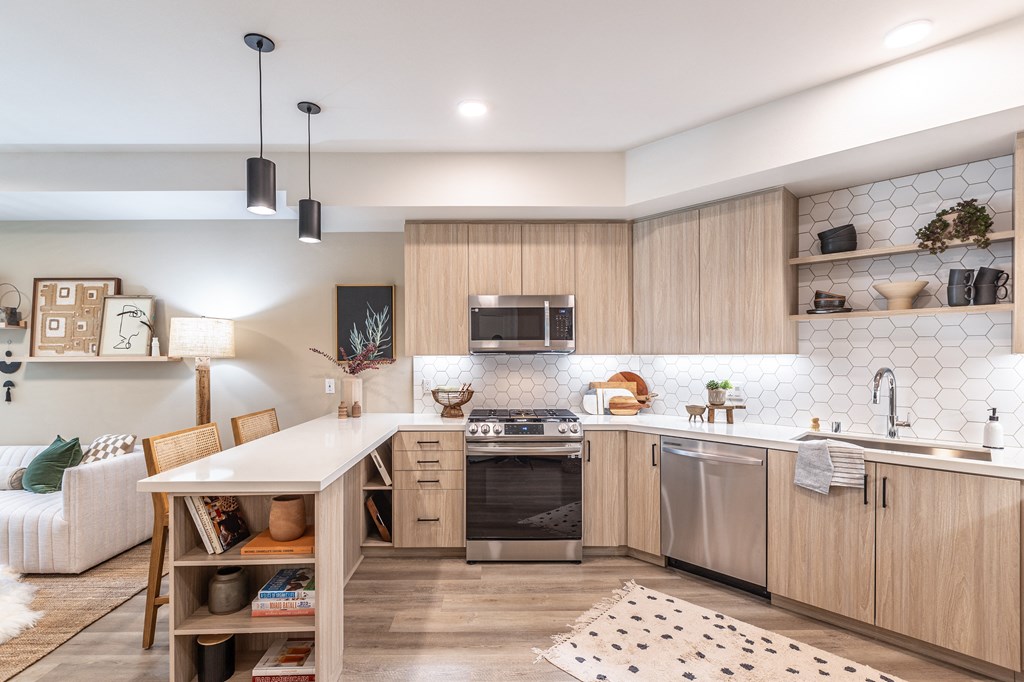 a kitchen with wooden cabinets and a white countertop