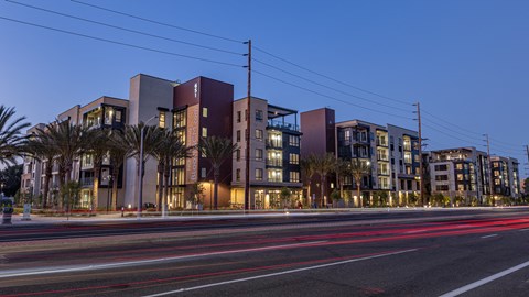 a city at night with cars on the road