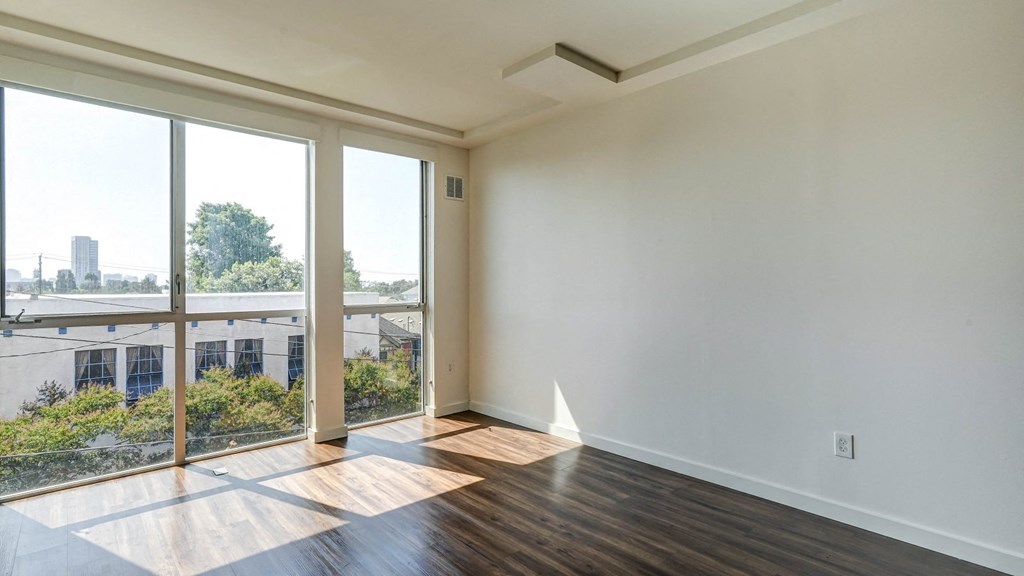 living room with wood floors and large windows