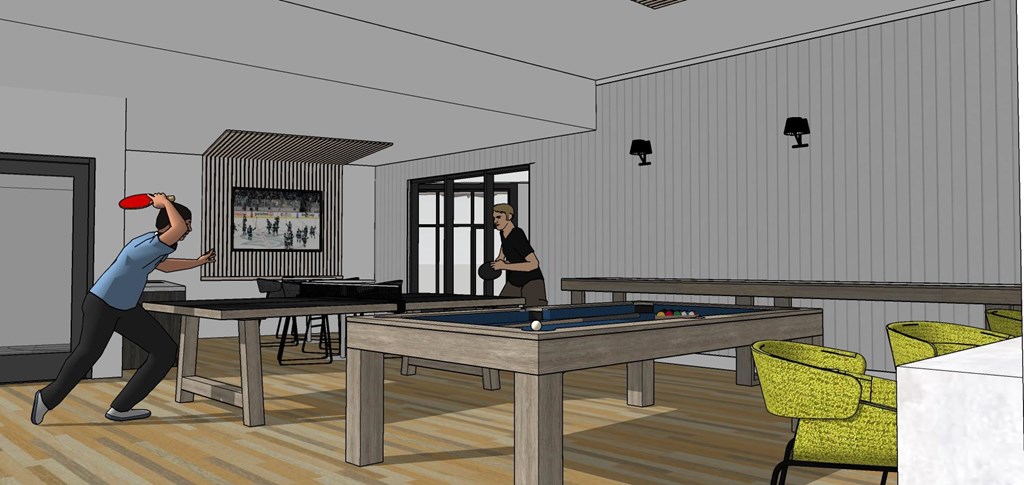 A man is playing pool in a room with a pool table.