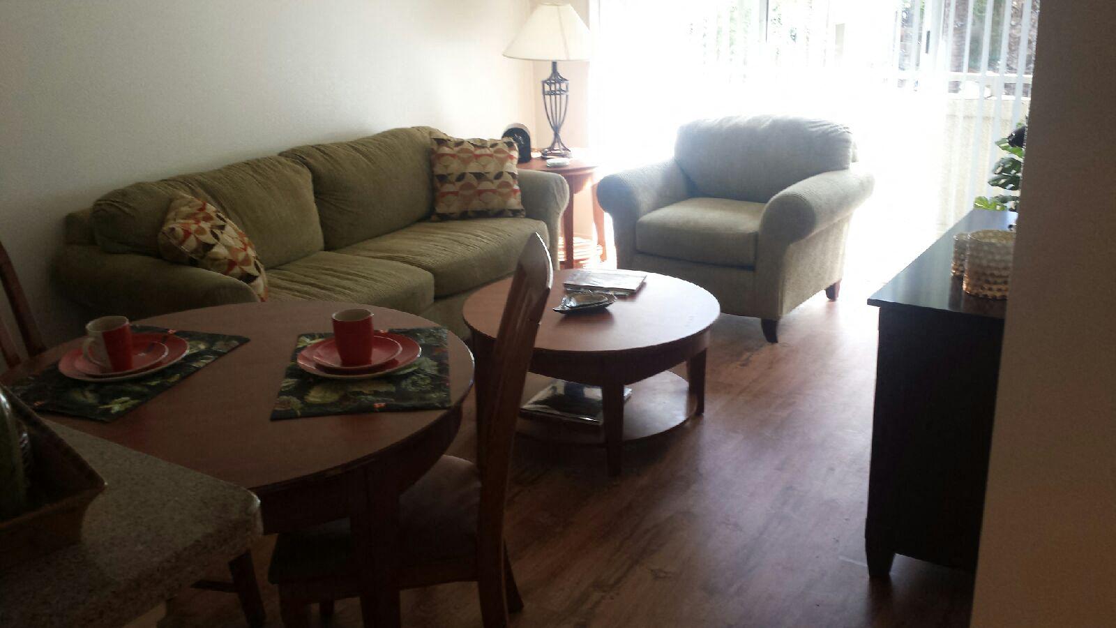 a living room with a couch and a table