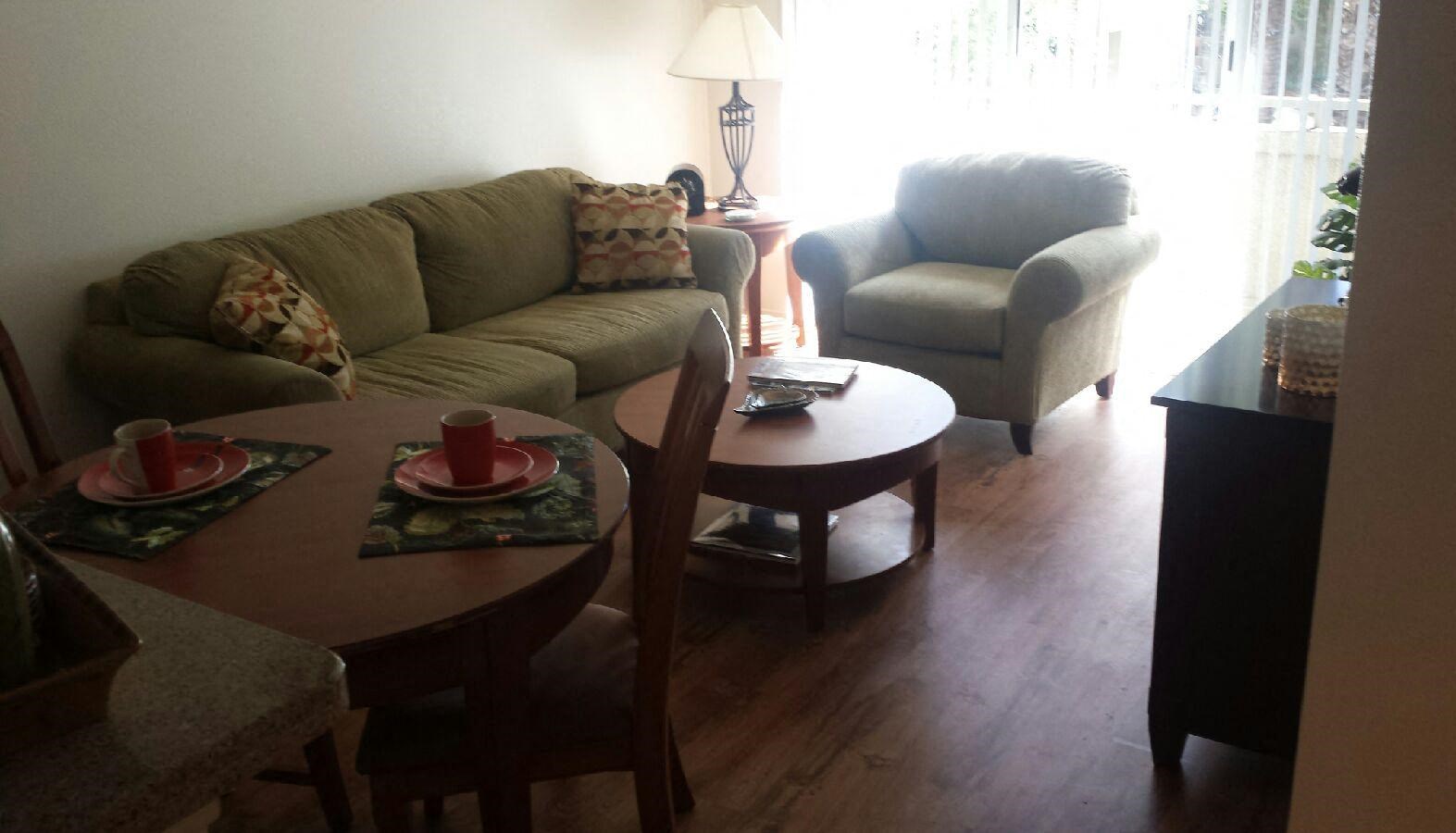 a living room with a couch and a table