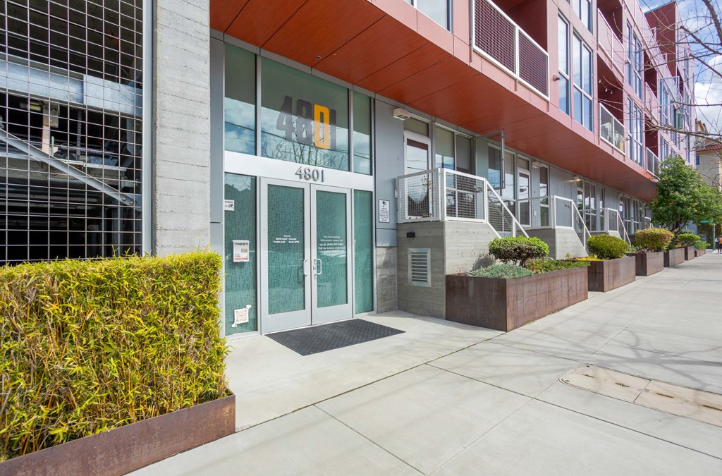 The image shows a building with a glass door and a number 4601 on it.