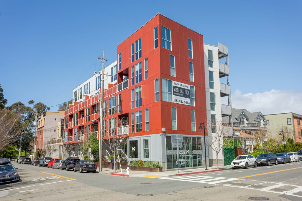A red building with a sign that says "The Standard" on it.
