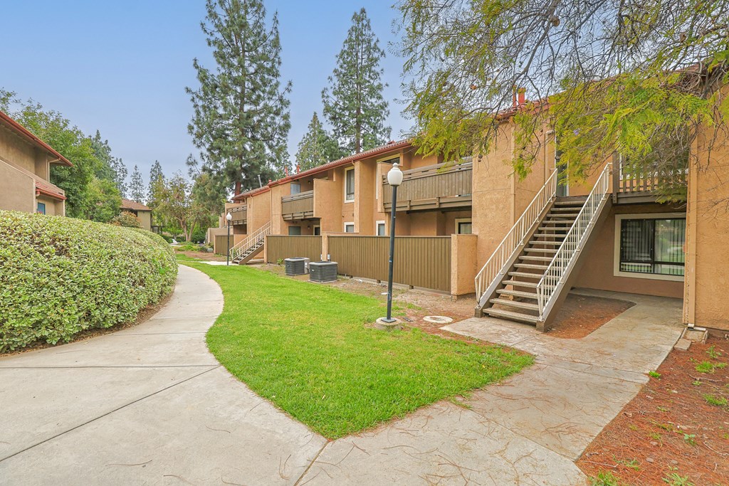 A residential area with apartment buildings and a clear sky.
