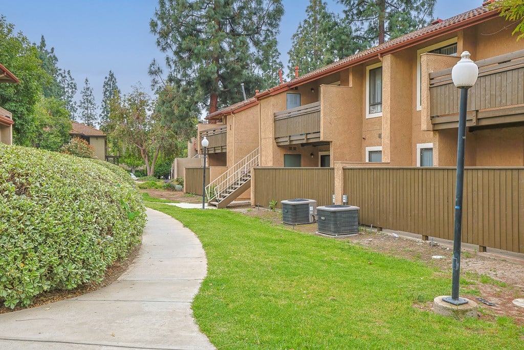A residential area with apartment buildings and a clear sky.