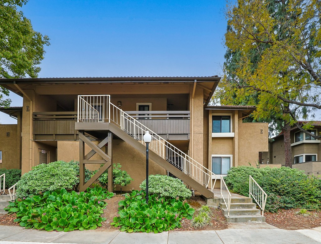 A residential area with apartment buildings and a clear sky.