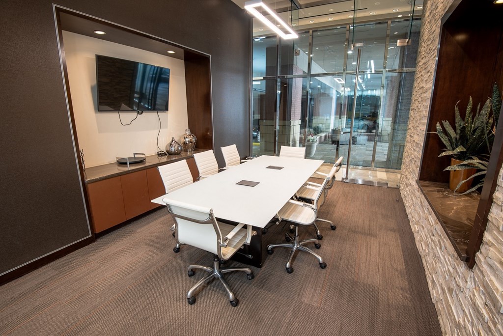 a room filled with furniture and a large window