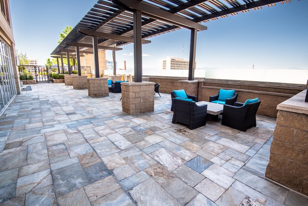 an outdoor patio with a pergola