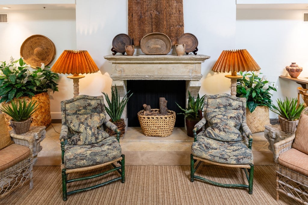 a living room filled with furniture and a fireplace