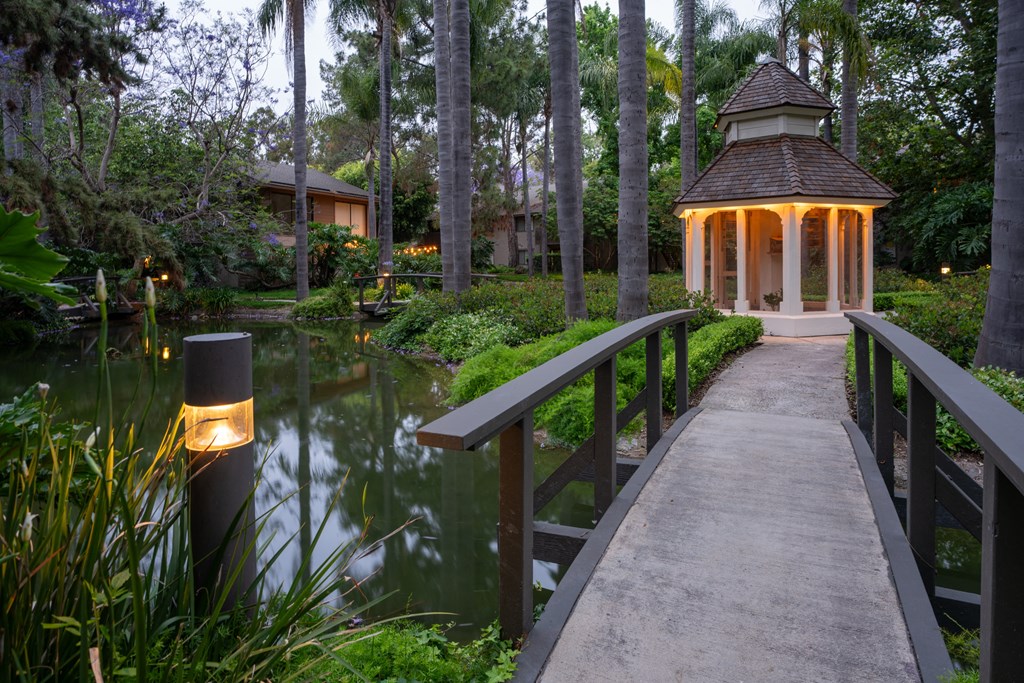 the walkway to the gazebo and pond at the resort