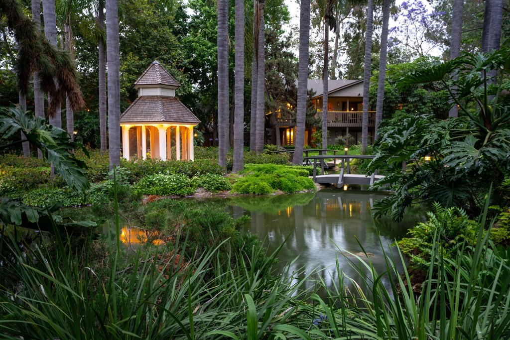 the gazebo in the middle of the pond at the resort