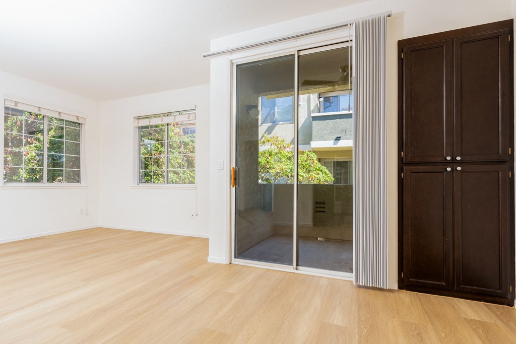 a living room with a sliding glass door to a bathroom