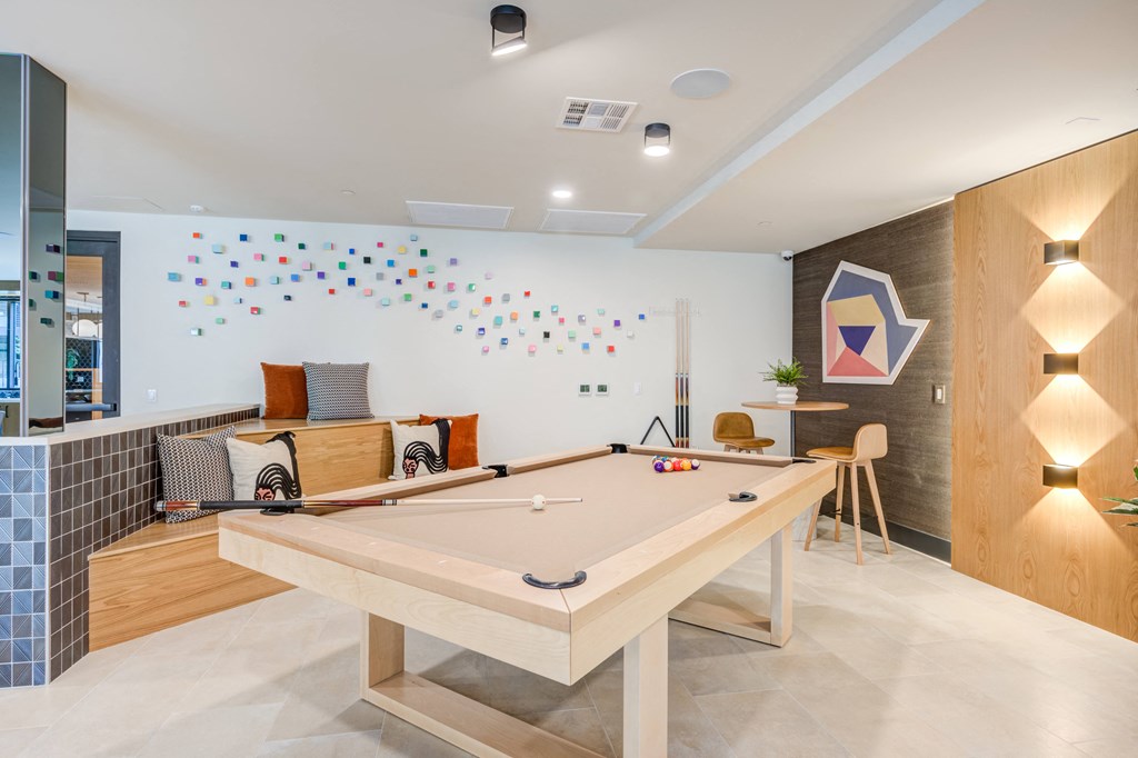 a games room with a ping pong table