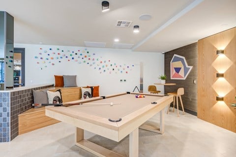 a games room with a ping pong table