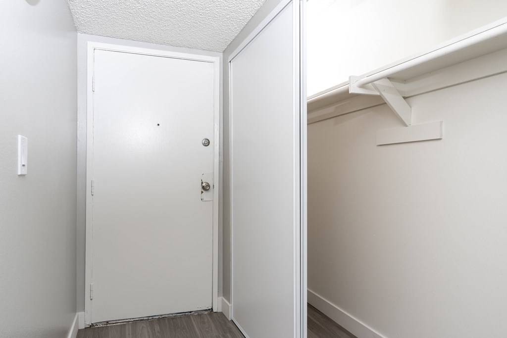 the exterior of a building with palm trees in front of it