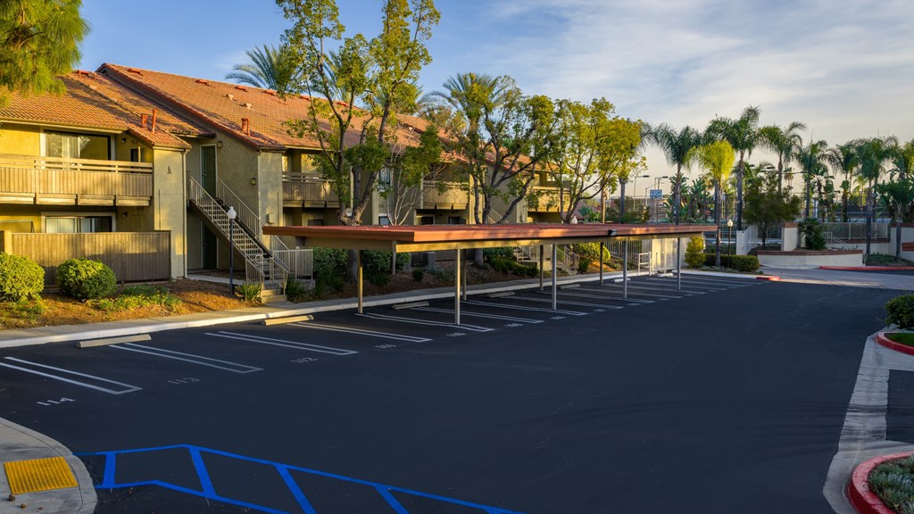 A parking lot with a blue painted crosswalk.