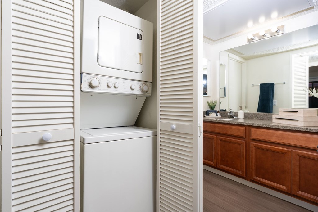 A white oven and microwave in a modern kitchen.