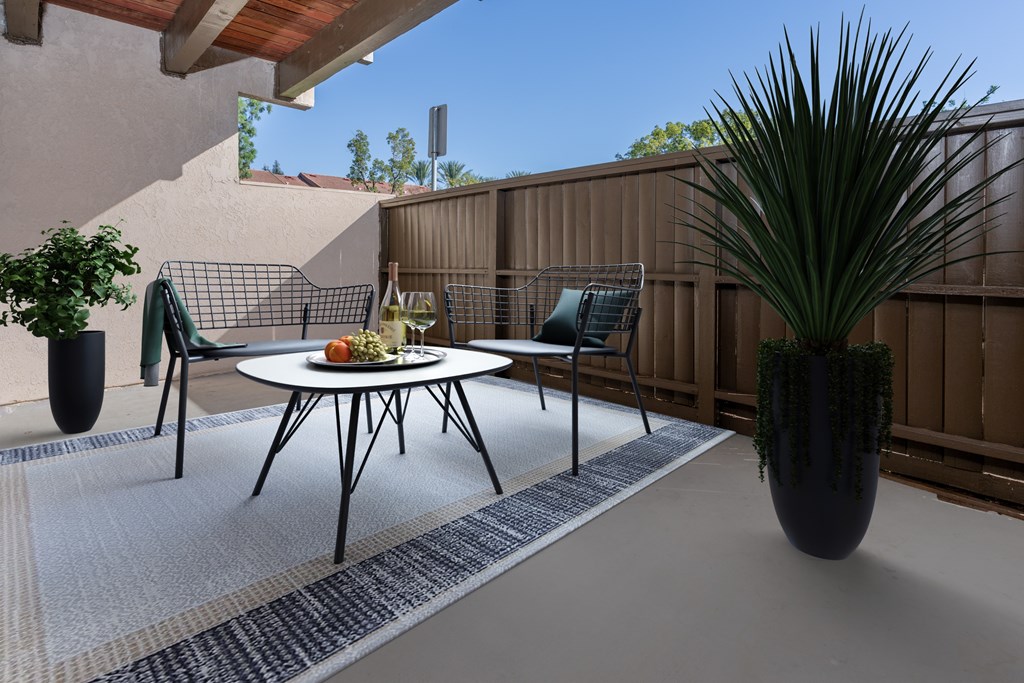 A patio with a table and chairs is shown.