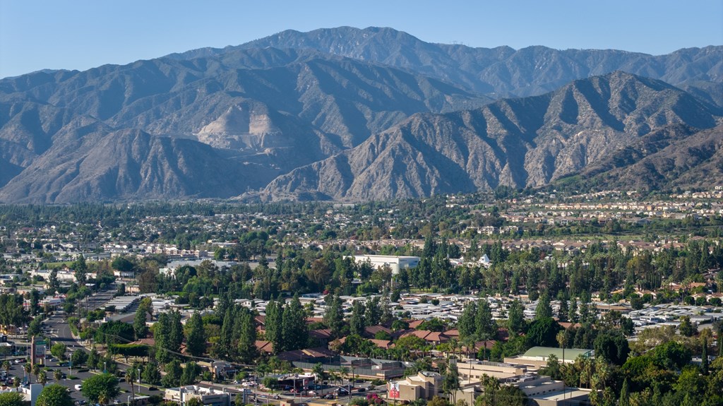 A mountain range rises behind a town.