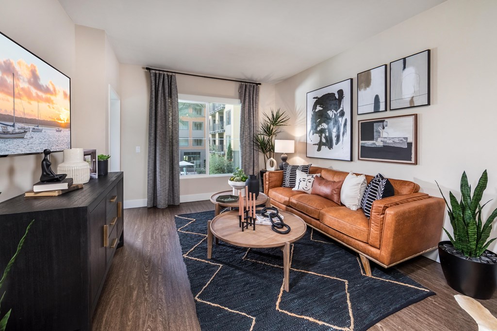 a living room with a leather couch and a coffee table