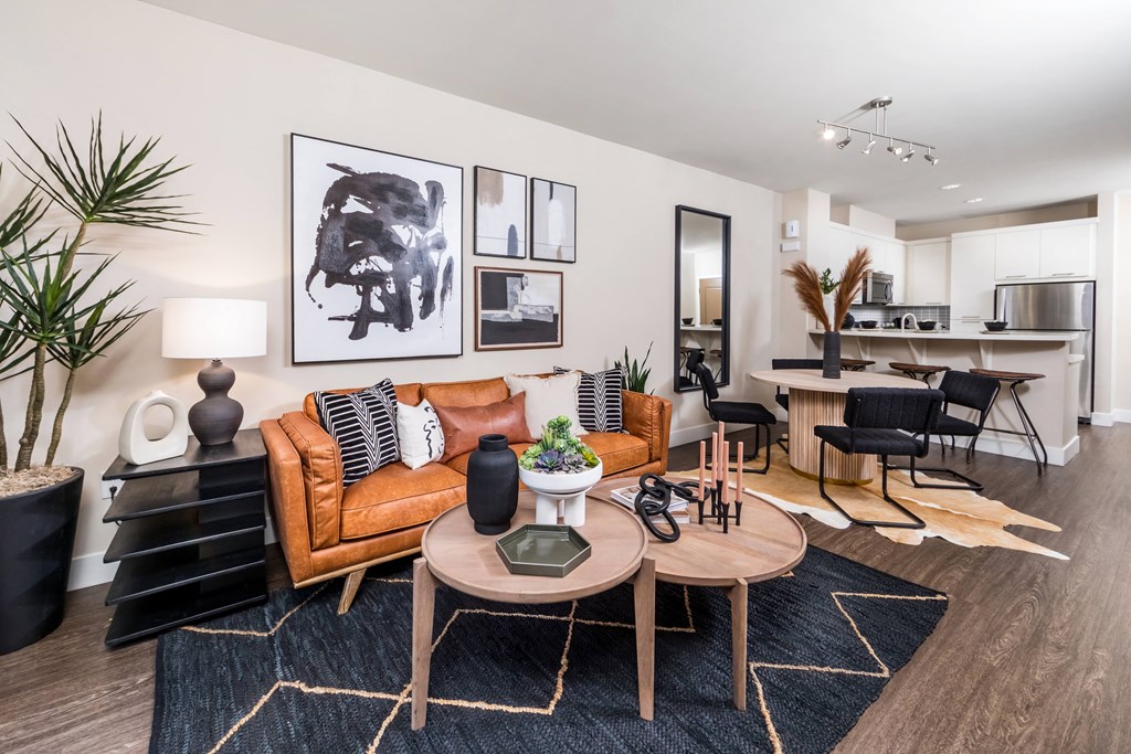 a living room with a leather couch and a coffee table