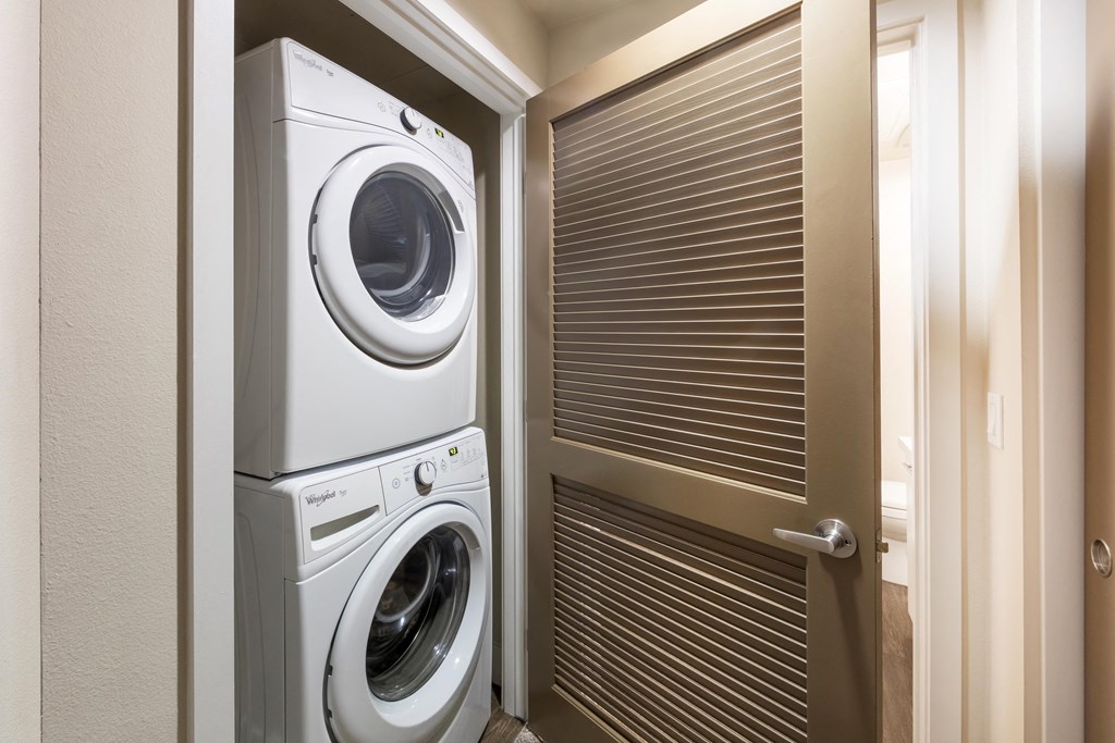 a small laundry room with a washing machine and a dryer