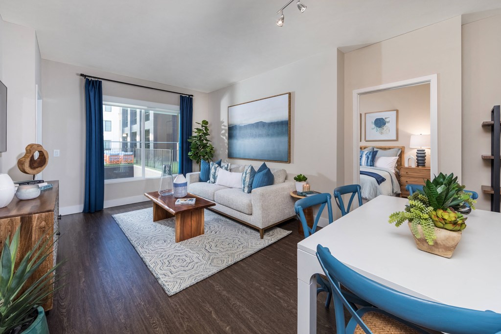 an open living room and dining room with a couch and a table