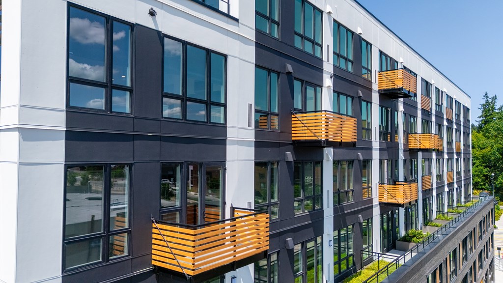A modern building with balconies and windows.