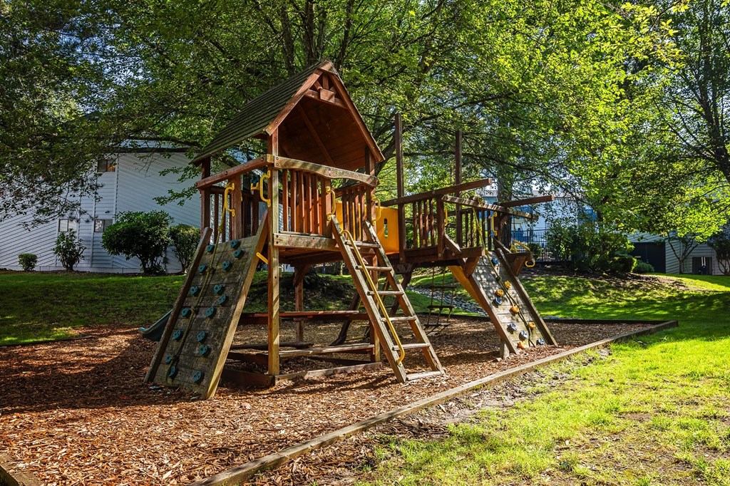 a swing set in the backyard at Copper Ridge Apartments, Renton, WA