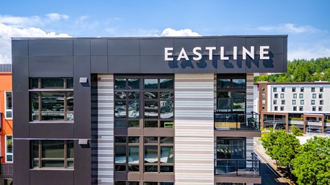 A modern building with the name EASTLINE on the top.