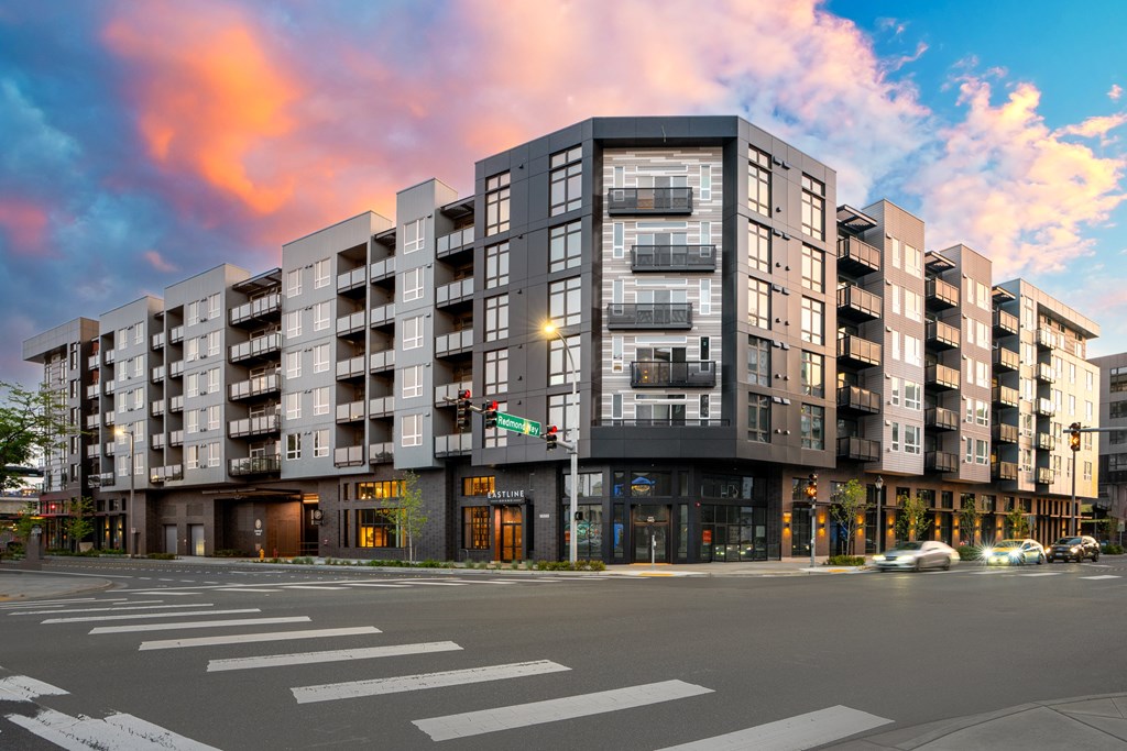 a rendering of an apartment building on a city street