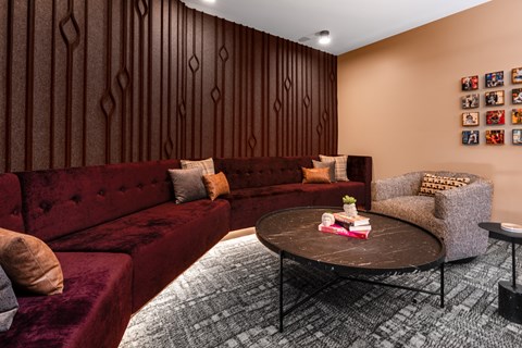 a living room with couches and a round table