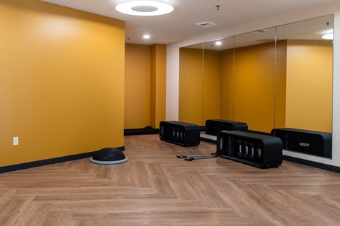 a group of chairs in a room with yellow walls