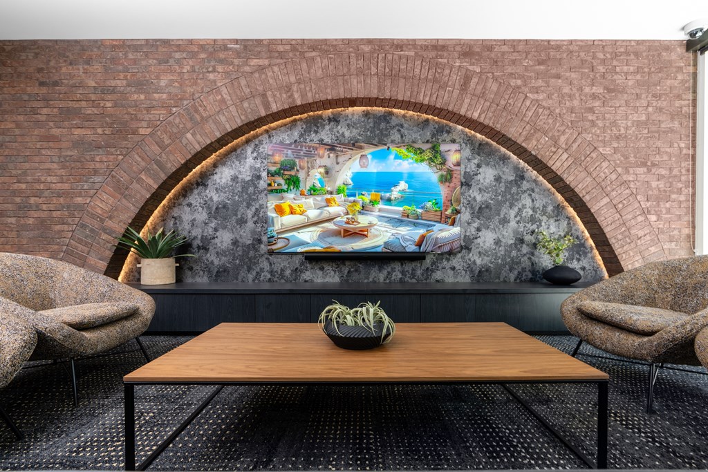 a wall mural in a cafe with a table and chairs