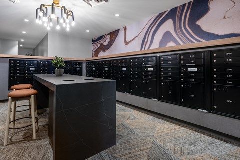 a large locker room with a black desk and a chair