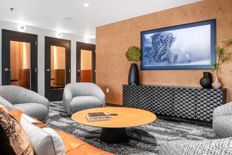 a living room with couches and chairs and a table