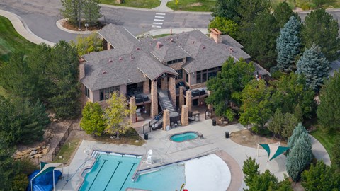 A large house with a pool in the backyard.