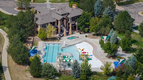 A large house with a pool and slide.