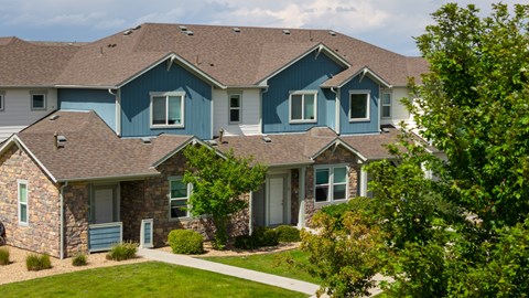 A house with a blue roof and white walls.