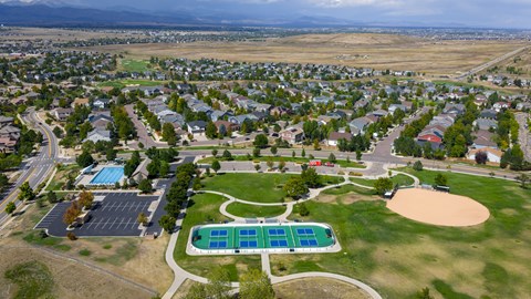A park with a swimming pool and a playground.