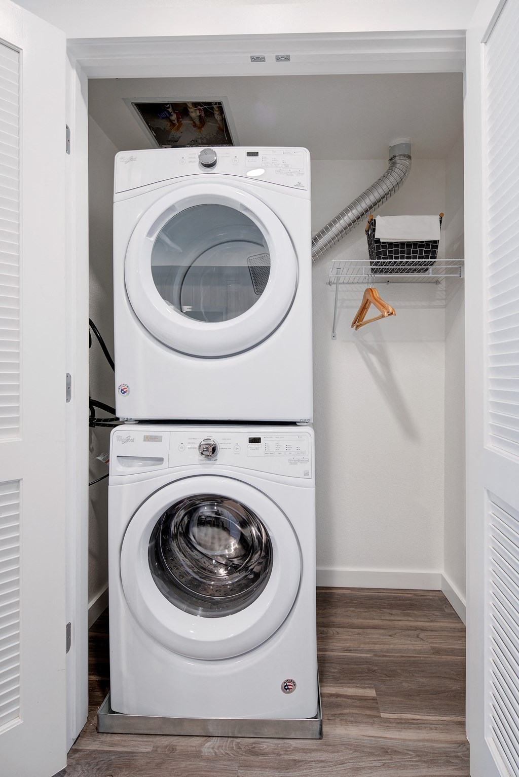 a washer and dryer in a small laundry room