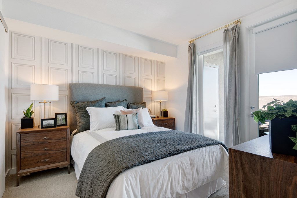 a bedroom with a large bed and a window