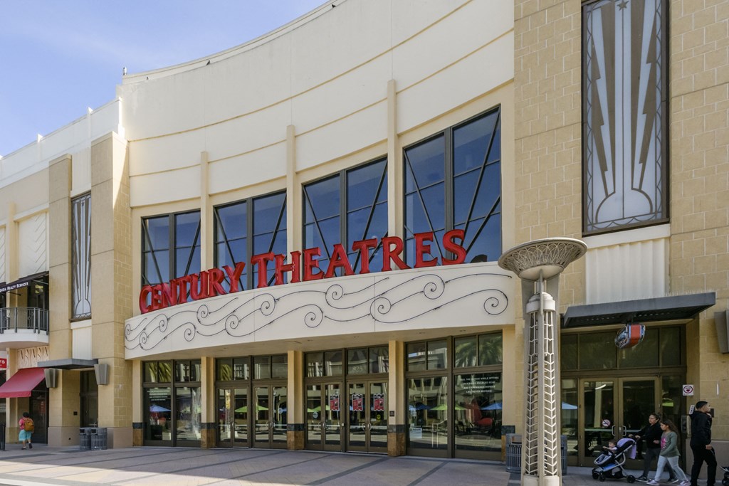 the front of a theater building with a sign that reads auditorium theaters
