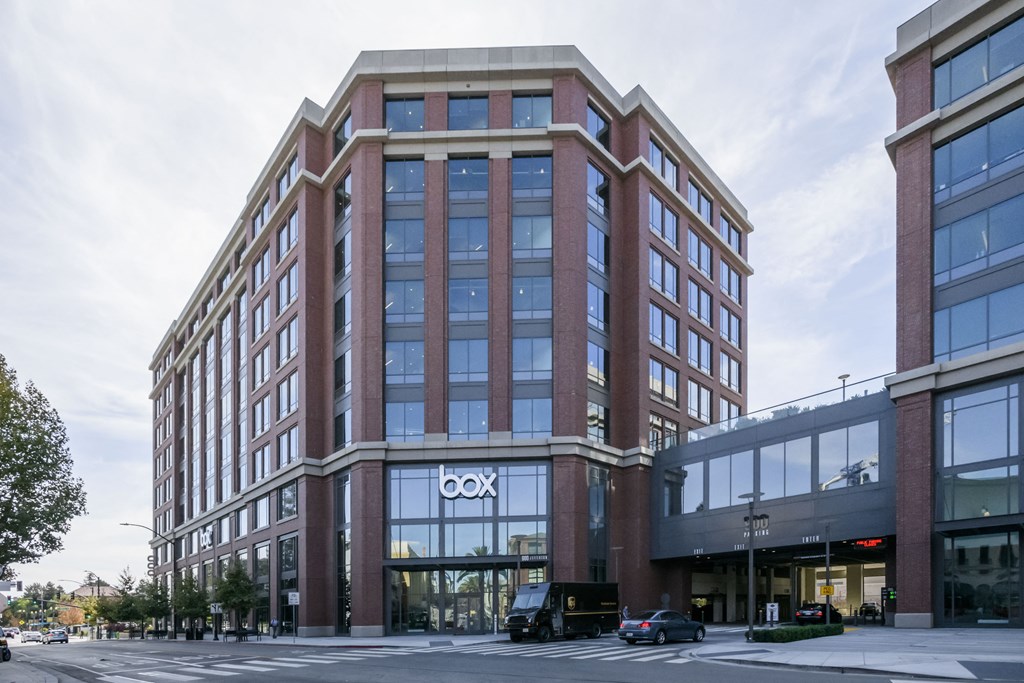 a tall brick building with a cxo sign on the front of it