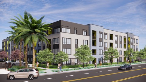 A street view of a modern apartment complex with cars and people.