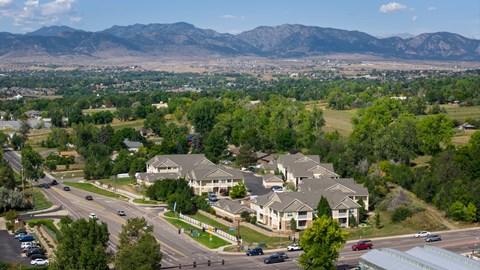 A suburban area with a mountain range in the background.